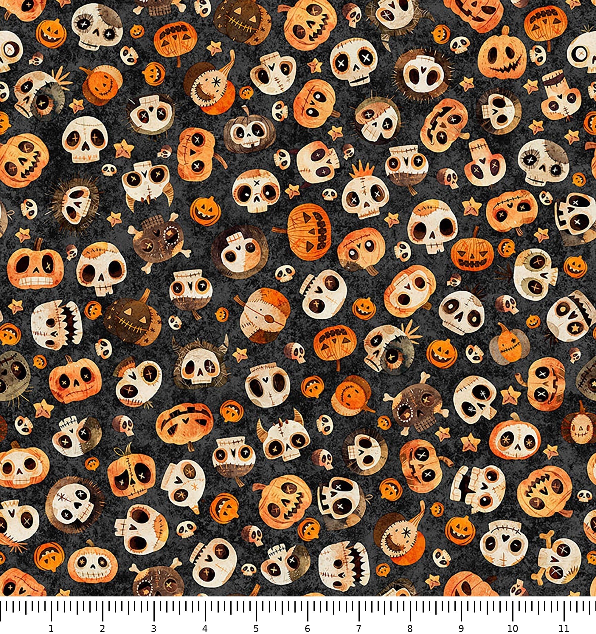 A Haunting We Will Go Skull & Pumpkin Toss 31947-J with inch ruler for scale
