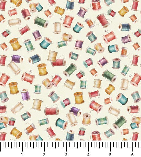 In Stitches Bobbins 30660-E with inch ruler for scale