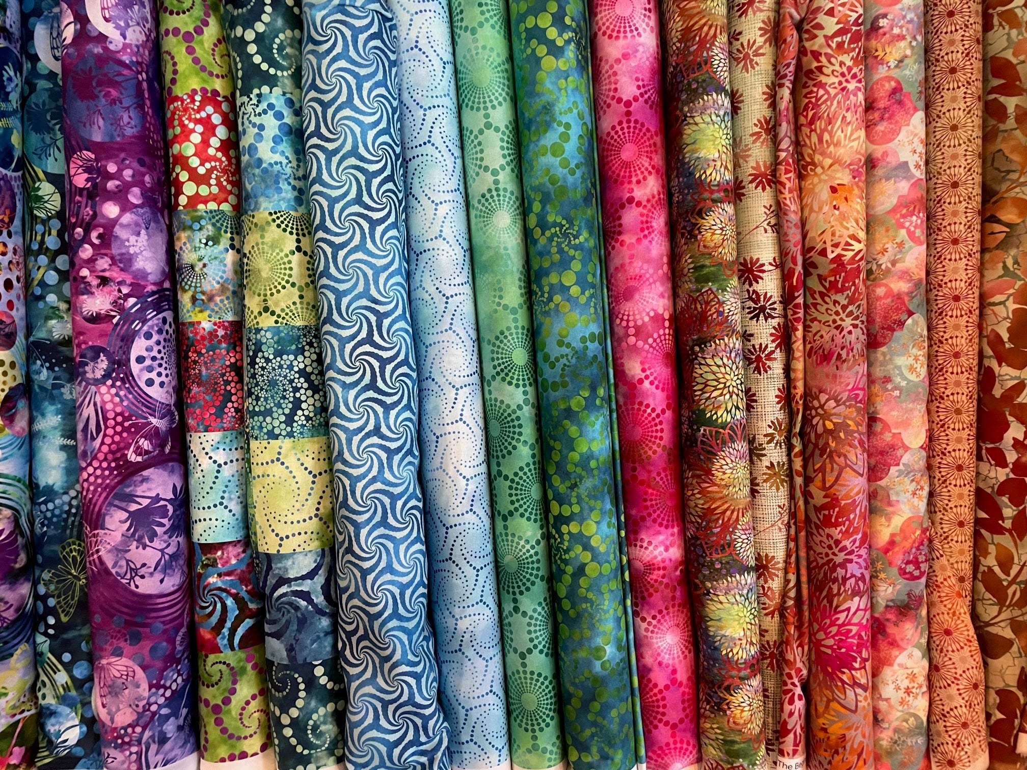 Colorful bolts of quilting fabric